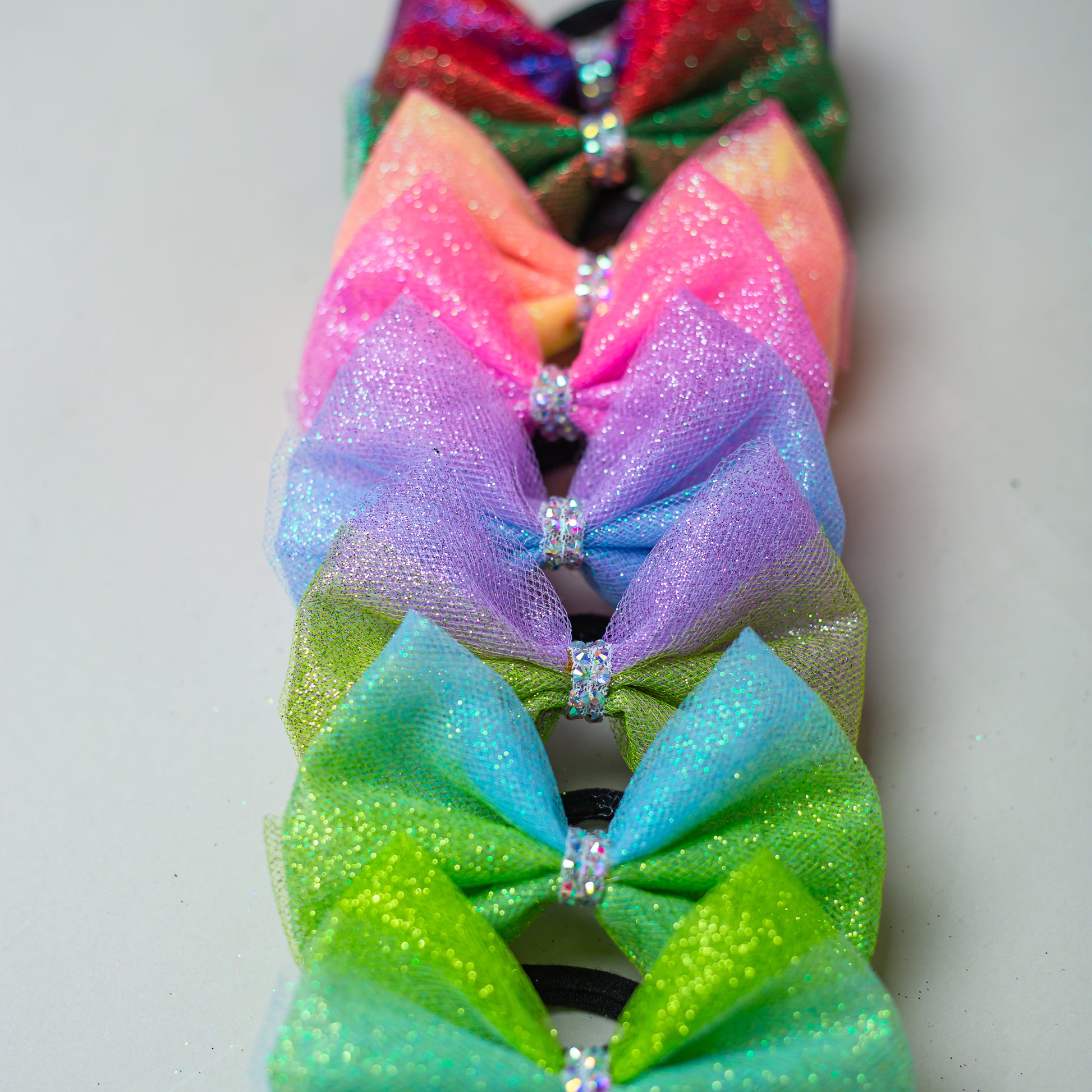 Ombre rhinestone hair bow catching the light, cbcsportswear