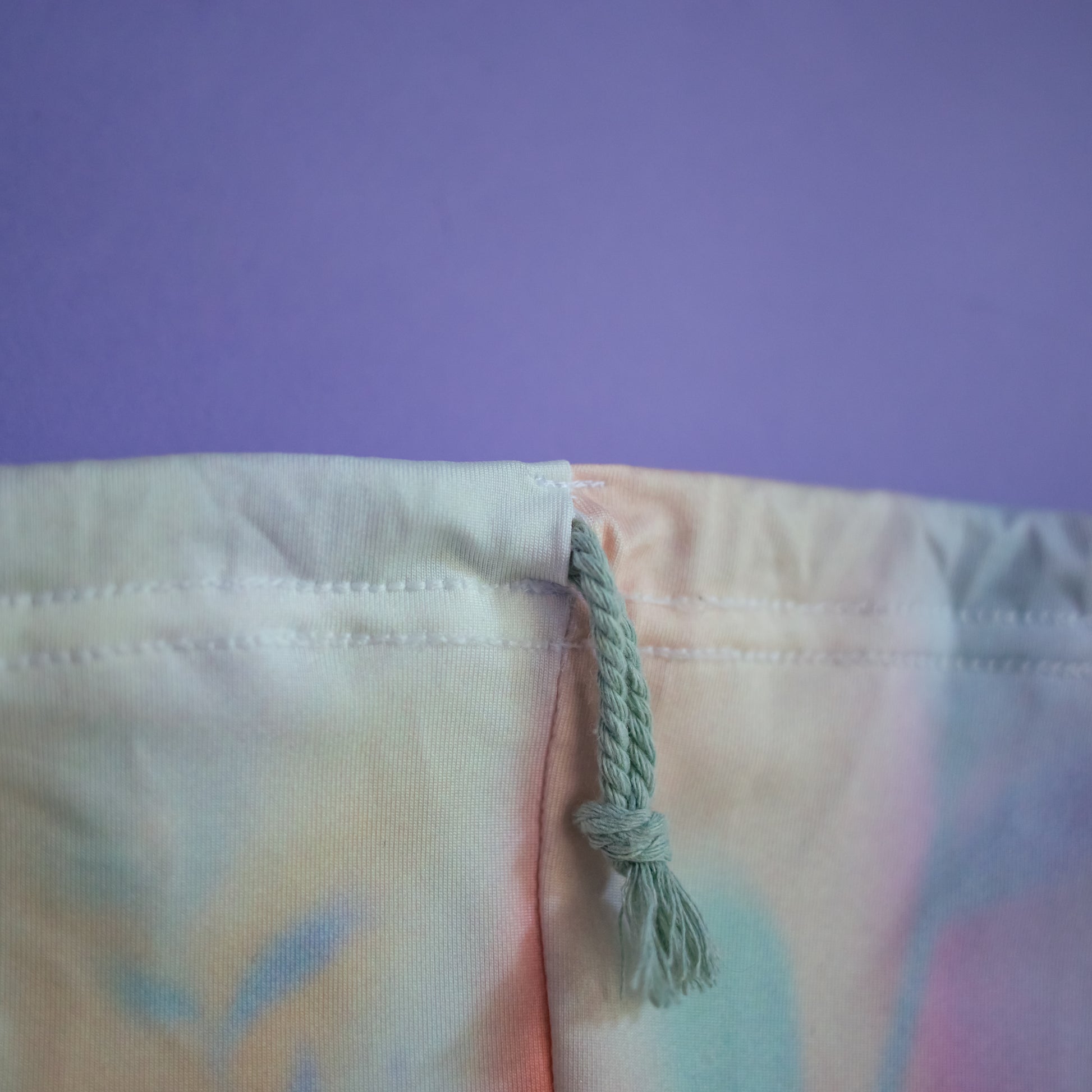 Close-up of the double drawstring closure on the gold marble grip bag, cbcsportswear