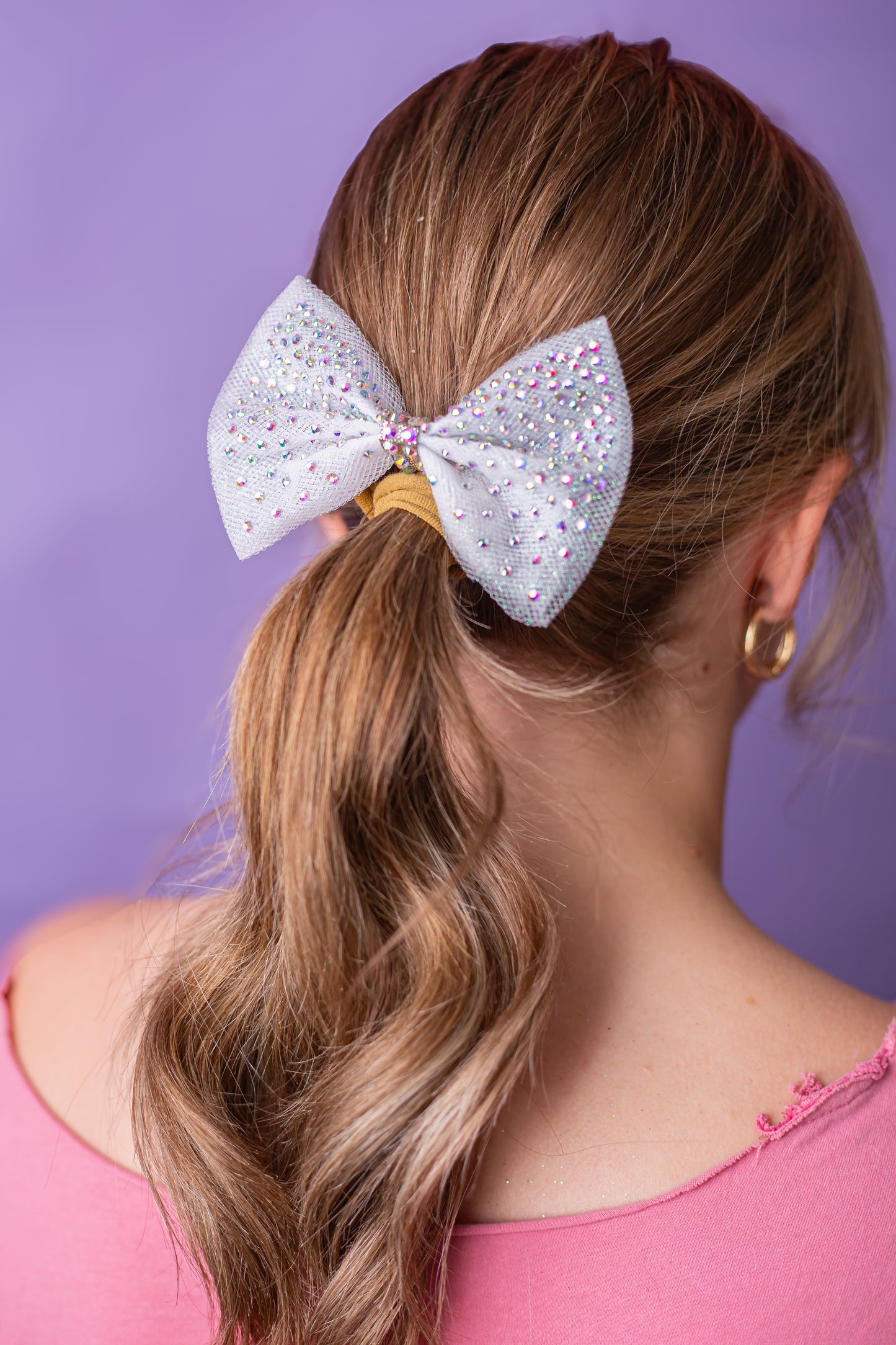 Rhinestone dipped gymnastics hair bow worn in a child's hair, cbcsportswear