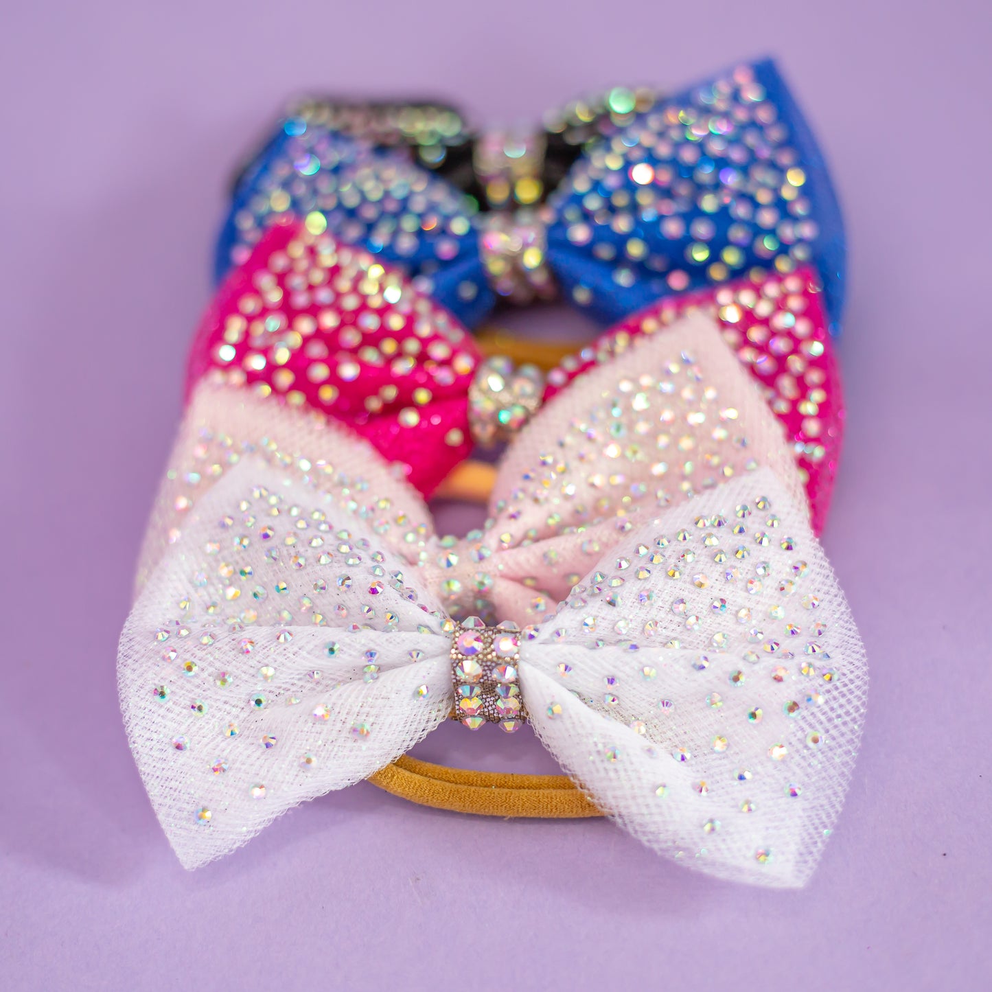 Rhinestone dipped hair bow catching the light, cbcsportswear
